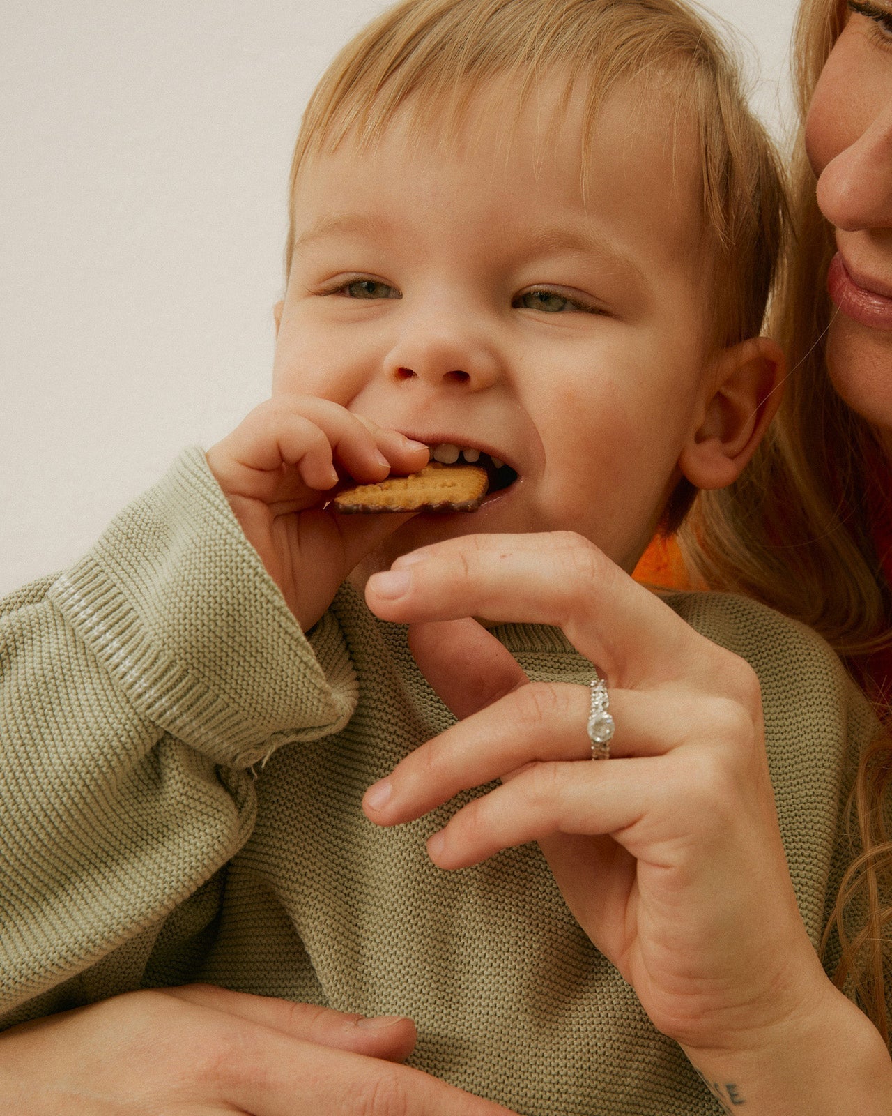 mother feeding a toddler to support the infant gut microbiome