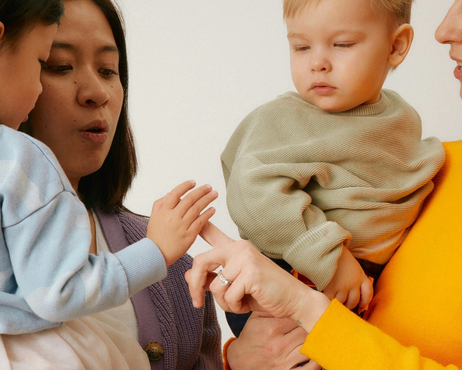 Babies and their moms playing