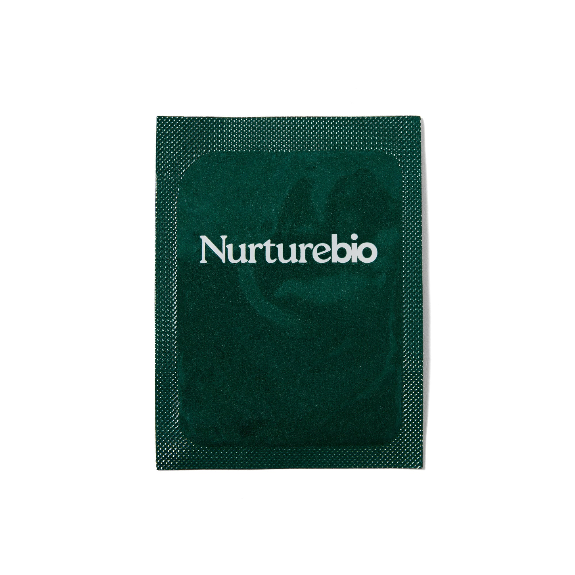NurtureBio single-serve sachet on a soft cream surface